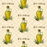 オリーブオイルのボトルと実